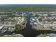 Aerial view of a waterfront property with a private boat dock and canal access to the Gulf of Mexico at 18602 Ashcroft Cir, Port Charlotte, FL 33948