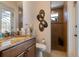 Bathroom with a shower, toilet, sink with granite countertop, and modern artistic design at 18602 Ashcroft Cir, Port Charlotte, FL 33948