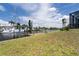 Wooden dock with boat lift and sailboat at 18602 Ashcroft Cir, Port Charlotte, FL 33948