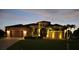 Front exterior of home with manicured landscaping and a two-car garage at 18602 Ashcroft Cir, Port Charlotte, FL 33948