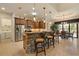 Open kitchen with stainless steel appliances, breakfast bar and adjacent dining area at 18602 Ashcroft Cir, Port Charlotte, FL 33948