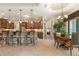 Kitchen with stainless appliances, breakfast bar, and seamless flow to the dining area at 18602 Ashcroft Cir, Port Charlotte, FL 33948