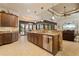 Open kitchen featuring stainless appliances, a breakfast bar, and views to the living room at 18602 Ashcroft Cir, Port Charlotte, FL 33948