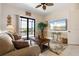 Relax in this comfy living room with sliding glass doors and expansive water view at 18602 Ashcroft Cir, Port Charlotte, FL 33948