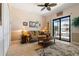 Living room has neutral tile floors and a sliding glass door to the outdoor space at 18602 Ashcroft Cir, Port Charlotte, FL 33948