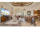 Inviting living room with high ceilings, leather sofas, large TV, and elegant decor at 18602 Ashcroft Cir, Port Charlotte, FL 33948