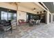 Covered patio with a brick floor, comfortable seating, and an outdoor dining table at 18602 Ashcroft Cir, Port Charlotte, FL 33948