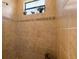 Shower stall featuring beautiful tile, a bench seat, and decor accents at 18602 Ashcroft Cir, Port Charlotte, FL 33948