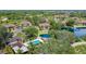 Condo complex with pool and adjacent serene pond at 19505 Quesada Ave # M104, Port Charlotte, FL 33948