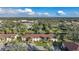 The aerial view shows the condo buildings surrounded by lush greenery, offering serene community living at 19505 Quesada Ave # M104, Port Charlotte, FL 33948