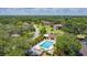 Community featuring a swimming pool, clubhouse, and lush landscaping, offering a resort-style living at 19505 Quesada Ave # M104, Port Charlotte, FL 33948
