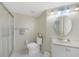 Clean bathroom featuring tile floors, a shower, toilet, and a vanity sink at 19505 Quesada Ave # M104, Port Charlotte, FL 33948