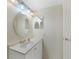 Clean bathroom with a mirrored vanity, sink, and modern fixtures at 19505 Quesada Ave # M104, Port Charlotte, FL 33948