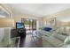 Inviting living room featuring modern decor and a view of the outdoors at 19505 Quesada Ave # M104, Port Charlotte, FL 33948