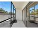 Screened-in patio, perfect for outdoor enjoyment with a privacy wall at 19505 Quesada Ave # M104, Port Charlotte, FL 33948
