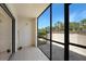 Covered screened-in patio featuring tile floor and exterior access to yard at 19505 Quesada Ave # M104, Port Charlotte, FL 33948