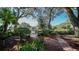 Beautiful pond view with lush landscaping and a bench at 19505 Quesada Ave # M104, Port Charlotte, FL 33948