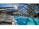 Beautiful swimming pool with chairs and tables for relaxing at 19505 Quesada Ave # M104, Port Charlotte, FL 33948