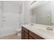 Well-lit bathroom featuring double sinks, a large mirror, and a shower-tub combination for convenience at 20067 Oakflower Ave, Tampa, FL 33647