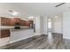 Open-concept kitchen features modern stainless appliances, sleek countertops, and ample cabinet space for storage at 20067 Oakflower Ave, Tampa, FL 33647