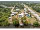 Aerial view of property featuring fenced yard and waterfront dock at 2008 Pellam Blvd, Port Charlotte, FL 33948