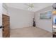 Neutral bedroom with a ceiling fan and a window for natural light at 2008 Pellam Blvd, Port Charlotte, FL 33948