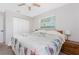 Bedroom with neutral colors, a ceiling fan, and ample closet space at 2008 Pellam Blvd, Port Charlotte, FL 33948