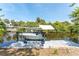 A private boat dock with boat lift, offering convenient waterfront access to enjoy boating activities at 2008 Pellam Blvd, Port Charlotte, FL 33948