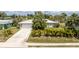 Charming single-story home featuring a well-maintained lawn and mature palm trees at 2008 Pellam Blvd, Port Charlotte, FL 33948