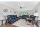 Bright living room with comfortable seating and a ceiling fan at 2008 Pellam Blvd, Port Charlotte, FL 33948