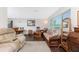 Comfortable living room with wood floors and bright natural light at 2008 Pellam Blvd, Port Charlotte, FL 33948