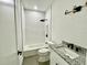 Well-lit bathroom with a tub, shower, and granite countertop vanity at 23120 Newcun Ave, Punta Gorda, FL 33980