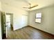 Bedroom featuring hardwood floors, a window with a view, and a closet at 23120 Newcun Ave, Punta Gorda, FL 33980