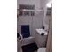 Bathroom features a shower-tub combo with sliding glass doors and a white vanity at 2328 Picnic St, Port Charlotte, FL 33952
