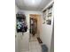 Hallway that connects to a kitchen area and dog bowls on the floor at 2328 Picnic St, Port Charlotte, FL 33952