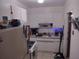 Kitchen with white cabinets, white appliances, and a stainless steel sink at 2328 Picnic St, Port Charlotte, FL 33952