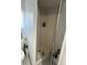 The stand up shower has a dark interior and is enclosed with glass at 2328 Picnic St, Port Charlotte, FL 33952