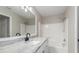 Bathroom with granite counters, matte black faucet, and a shower with white tub surround at 2381 Sheila Ln, North Port, FL 34286