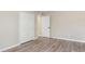 Bedroom with hardwood flooring, closet, and neutral paint at 2381 Sheila Ln, North Port, FL 34286