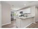 Open kitchen boasts granite countertops, stainless steel appliances and ample cabinet space at 2381 Sheila Ln, North Port, FL 34286