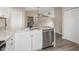 Bright kitchen with modern appliances, granite countertops, and stainless steel dishwasher at 2381 Sheila Ln, North Port, FL 34286