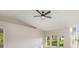Bright living room featuring modern ceiling fan, wood floors, neutral walls, and large windows at 2381 Sheila Ln, North Port, FL 34286
