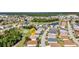 Beautiful aerial view of home in a golf community near a pond at 24371 Folkstone Ave, Punta Gorda, FL 33980