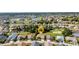 Serene aerial view of home in a beautiful community with lush landscaping and ponds at 24371 Folkstone Ave, Punta Gorda, FL 33980