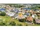 Overhead view of the home showcasing its landscaping in a mature community at 24371 Folkstone Ave, Punta Gorda, FL 33980