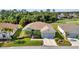 A well-maintained single-story house from above, featuring a manicured lawn, and mature landscaping at 24371 Folkstone Ave, Punta Gorda, FL 33980