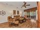 Cozy living room with wood floors, comfortable leather seating, and an inviting atmosphere at 24371 Folkstone Ave, Punta Gorda, FL 33980