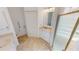Bright bathroom featuring tiled floors, modern fixtures, a walk-in shower, and a comfort-height toilet at 26089 Seminole Lakes Blvd, Punta Gorda, FL 33955