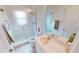Bright bathroom featuring a glass door shower, double sinks and neutral color palette at 26089 Seminole Lakes Blvd, Punta Gorda, FL 33955