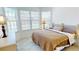 Cozy bedroom with large windows providing lots of natural light and a comfortable ambiance at 26089 Seminole Lakes Blvd, Punta Gorda, FL 33955